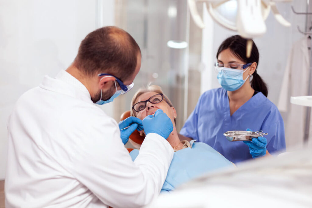 Senior woman getting stomatology treatment - Dr. Lukas Pytlik